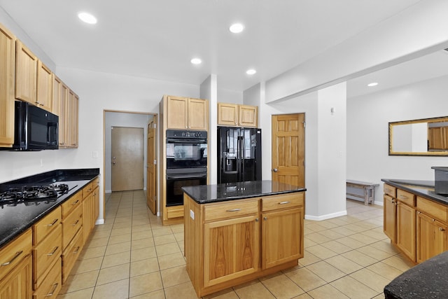 1365 Wilkes Way SE, Rio Rancho, NM 87124 - kitchen featuring black appliances, light tile patterned floors, a kitchen island, dark stone countertops, and baseboards