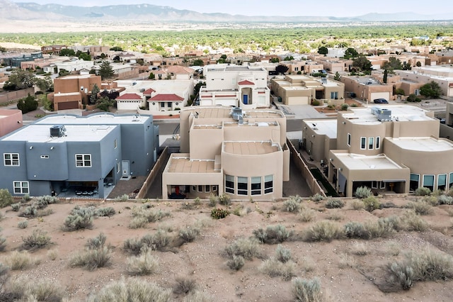 1365 Wilkes Way SE, Rio Rancho, NM 87124 - aerial perspective of suburban area with mountains