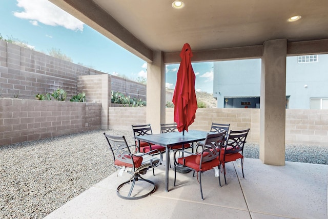 1365 Wilkes Way SE, Rio Rancho, NM 87124 - fenced backyard featuring a patio area and outdoor dining area