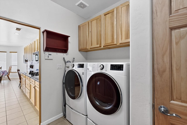 1365 Wilkes Way SE, Rio Rancho, NM 87124 - laundry room with light tile patterned flooring, washing machine and clothes dryer, cabinet space, and baseboards