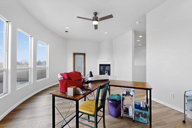 1365 Wilkes Way SE, Rio Rancho, NM 87124 - office space featuring a ceiling fan, wood finished floors, baseboards, recessed lighting, and a large fireplace