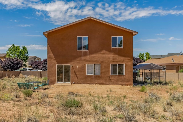 1343 San Juan Ct NE, Rio Rancho, NM 87144 - back of property featuring a gazebo and stucco siding