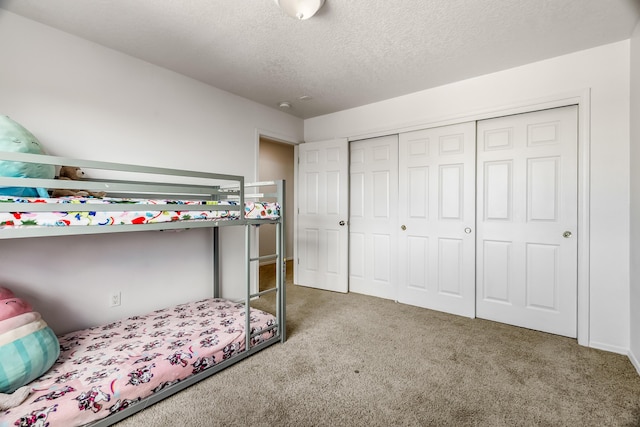 1343 San Juan Ct NE, Rio Rancho, NM 87144 - carpeted bedroom with a closet and a textured ceiling