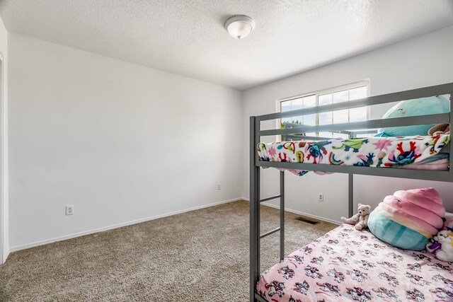 1343 San Juan Ct NE, Rio Rancho, NM 87144 - bedroom with carpet floors and a textured ceiling