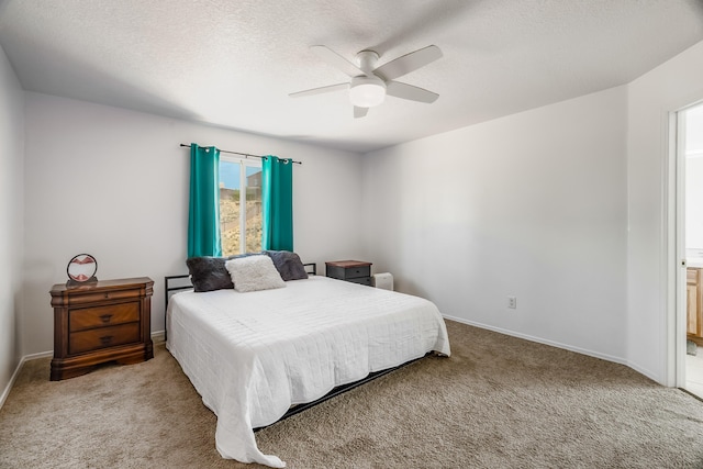 1343 San Juan Ct NE, Rio Rancho, NM 87144 - carpeted bedroom with a ceiling fan, a textured ceiling, and ensuite bath