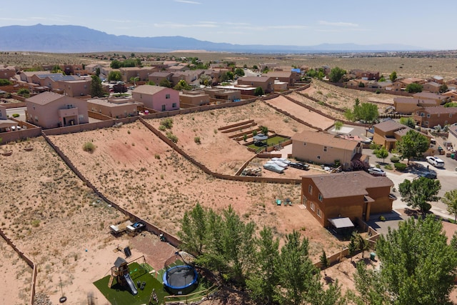 1343 San Juan Ct NE, Rio Rancho, NM 87144 - aerial perspective of suburban area featuring a desert landscape and a mountainous background
