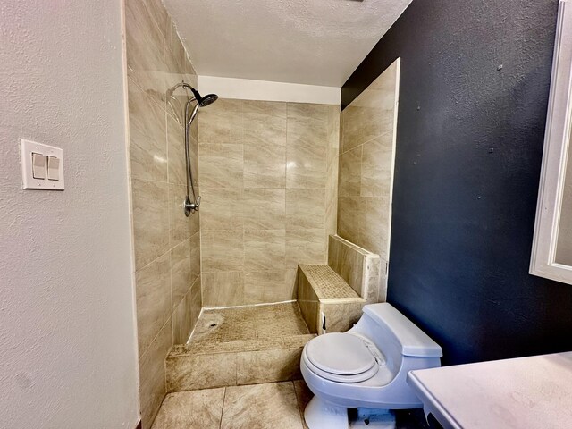 3901 70th St NW, Albuquerque, NM 87120 - full bath with a tile shower, toilet, a textured wall, and tile patterned flooring