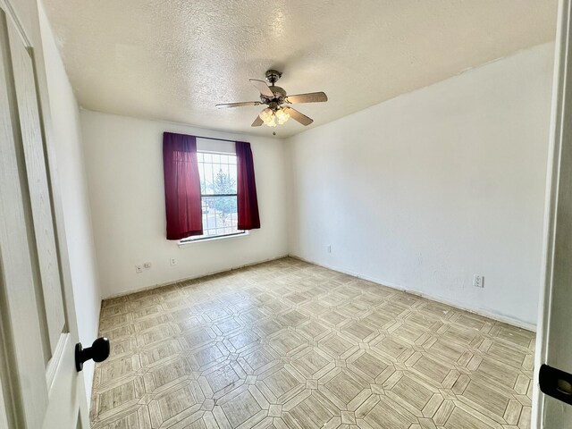 3901 70th St NW, Albuquerque, NM 87120 - unfurnished room featuring a ceiling fan and a textured ceiling