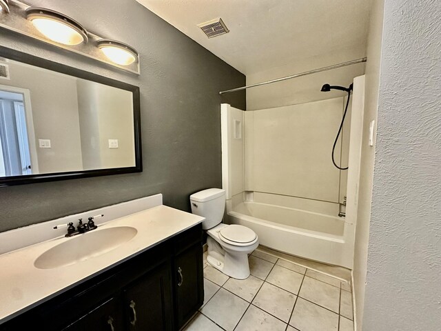 3901 70th St NW, Albuquerque, NM 87120 - full bathroom featuring a textured wall, tile patterned floors, toilet, vanity, and washtub / shower combination