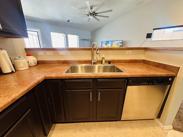 6275 Nueva Espana Rd NW, Albuquerque, NM 87114 - kitchen featuring dishwasher, a sink, ceiling fan, vaulted ceiling, and light tile patterned floors