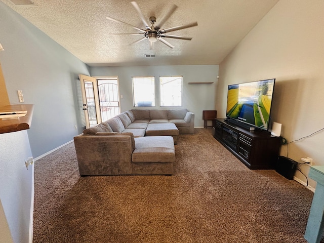 6275 Nueva Espana Rd NW, Albuquerque, NM 87114 - living area with carpet, ceiling fan, a textured ceiling, and baseboards