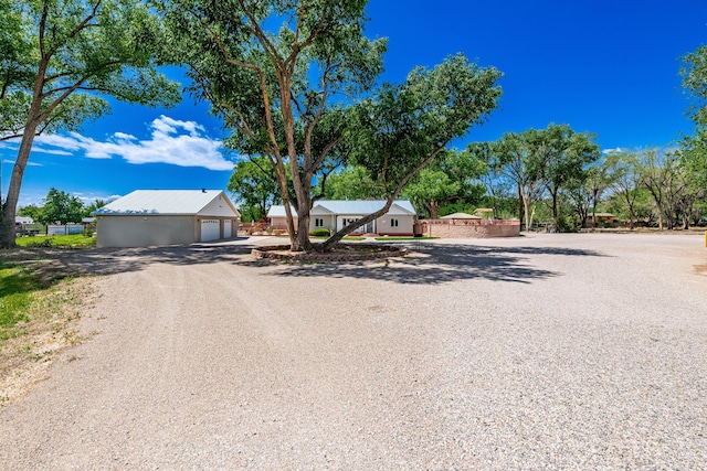 7909 Rancho De Roberto Rd NW, Albuquerque, NM 87114 - view of front facade featuring driveway and an outdoor structure