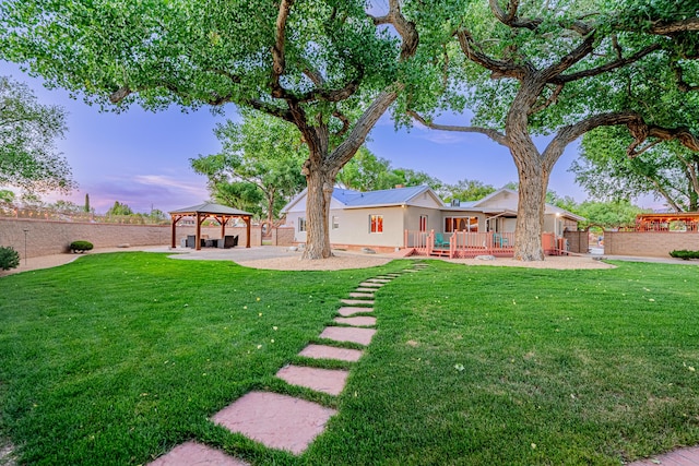 7909 Rancho De Roberto Rd NW, Albuquerque, NM 87114 - yard at dusk featuring a gazebo and a patio