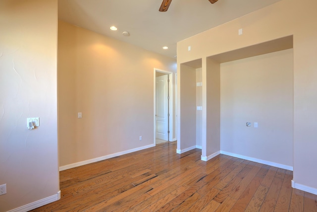 1624 23rd Ave SE, Rio Rancho, NM 87124 - spare room with wood-type flooring, a ceiling fan, baseboards, and recessed lighting