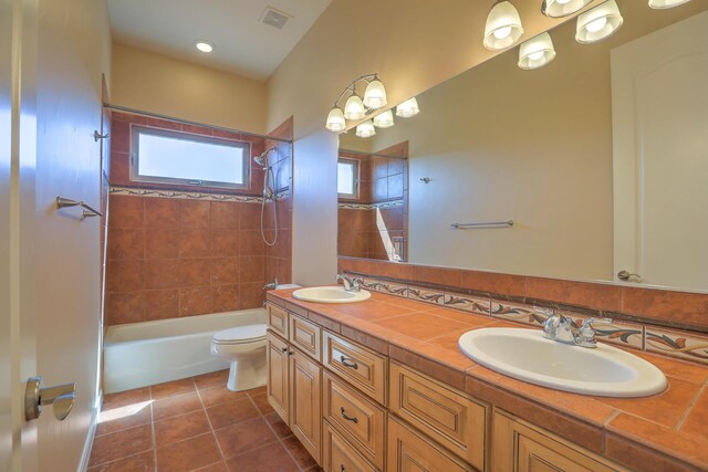 1624 23rd Ave SE, Rio Rancho, NM 87124 - full bathroom with double vanity, toilet,  shower combination, and tile patterned flooring