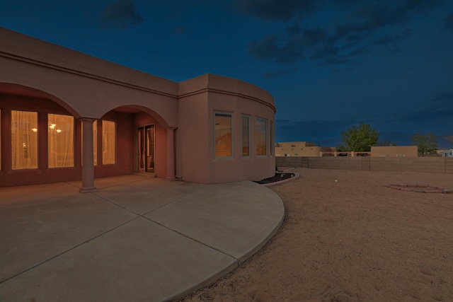1624 23rd Ave SE, Rio Rancho, NM 87124 - view of home's exterior featuring a patio area, a fenced backyard, and stucco siding