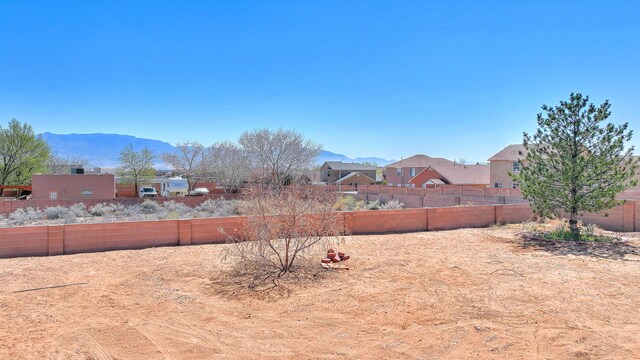 1624 23rd Ave SE, Rio Rancho, NM 87124 - fenced backyard featuring a mountain view and a residential view