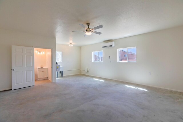 1624 23rd Ave SE, Rio Rancho, NM 87124 - spare room featuring a wall mounted AC, ceiling fan, a sink, and baseboards