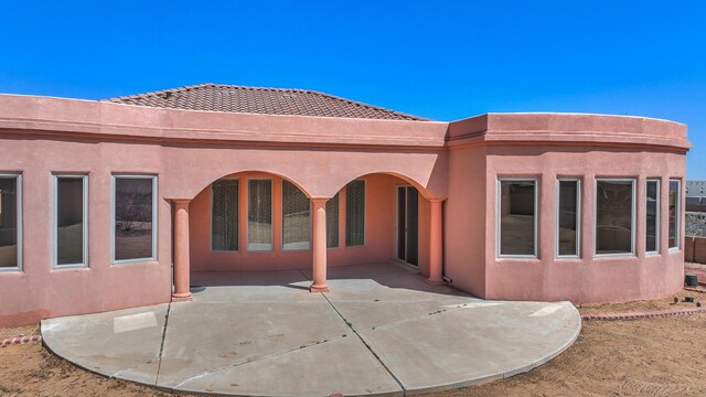 1624 23rd Ave SE, Rio Rancho, NM 87124 - rear view of property featuring stucco siding, a patio, and a tile roof