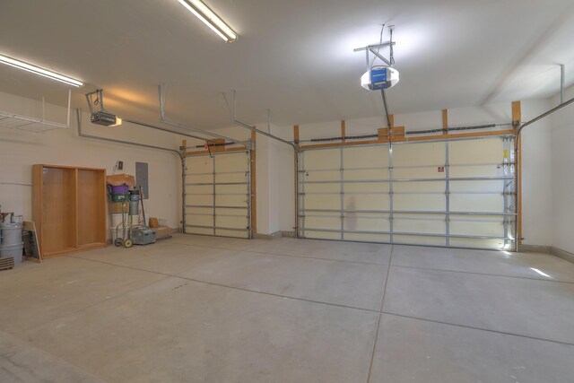 1624 23rd Ave SE, Rio Rancho, NM 87124 - garage with a garage door opener and electric panel