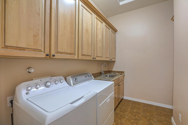 1624 23rd Ave SE, Rio Rancho, NM 87124 - washroom featuring washing machine and clothes dryer, cabinet space, and baseboards