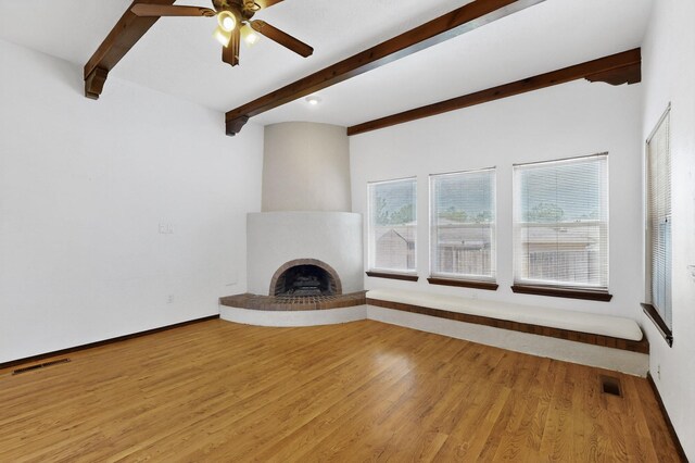 10017 Boulder St NW, Albuquerque, NM 87114 - unfurnished living room featuring beamed ceiling, light wood finished floors, a fireplace, and ceiling fan