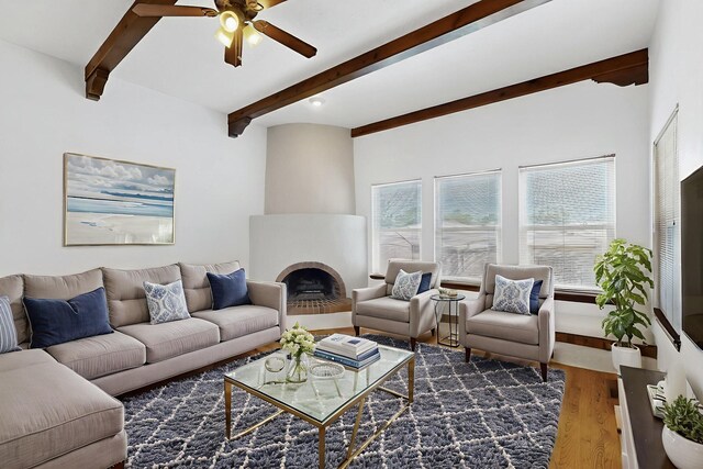 10017 Boulder St NW, Albuquerque, NM 87114 - living area with beam ceiling, wood finished floors, a ceiling fan, and a fireplace