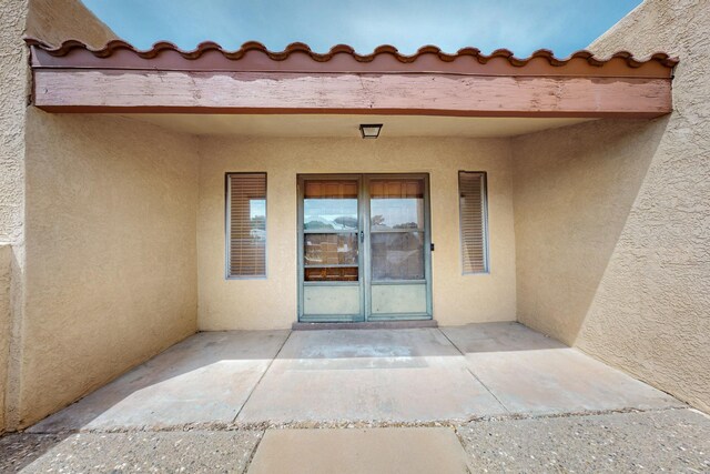 10017 Boulder St NW, Albuquerque, NM 87114 - property entrance with stucco siding and a patio