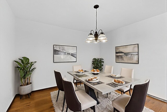 10017 Boulder St NW, Albuquerque, NM 87114 - dining space featuring a chandelier and wood finished floors
