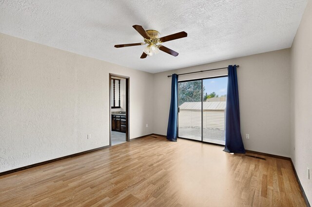 10017 Boulder St NW, Albuquerque, NM 87114 - unfurnished room featuring light wood-type flooring, a ceiling fan, and a textured ceiling