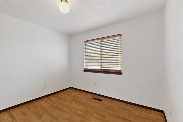 10017 Boulder St NW, Albuquerque, NM 87114 - spare room with light wood-style flooring and baseboards