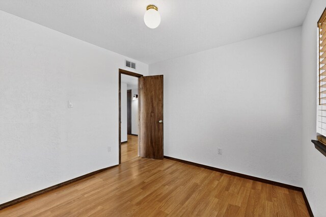 10017 Boulder St NW, Albuquerque, NM 87114 - unfurnished room featuring wood finished floors and baseboards