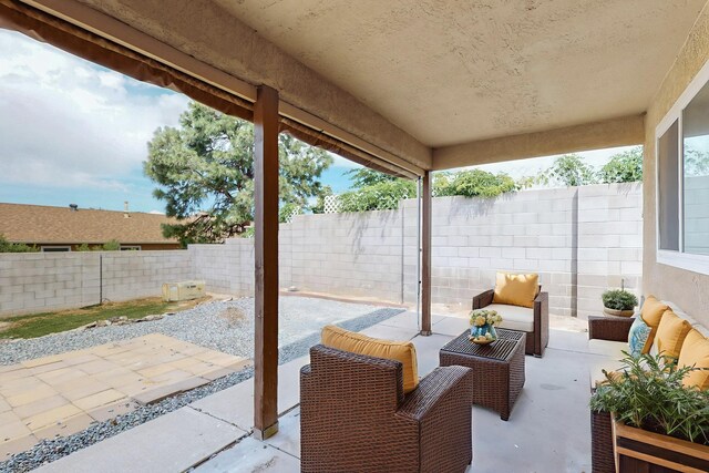 10017 Boulder St NW, Albuquerque, NM 87114 - fenced backyard with a patio area and an outdoor living space