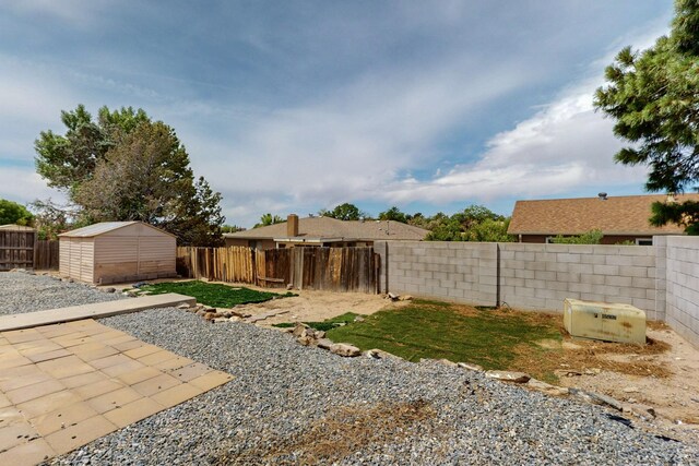 10017 Boulder St NW, Albuquerque, NM 87114 - fenced backyard with a storage unit