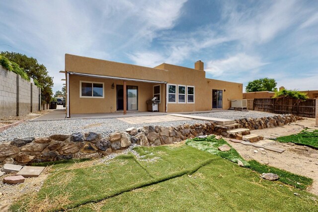 10017 Boulder St NW, Albuquerque, NM 87114 - rear view of house featuring a patio area and stucco siding