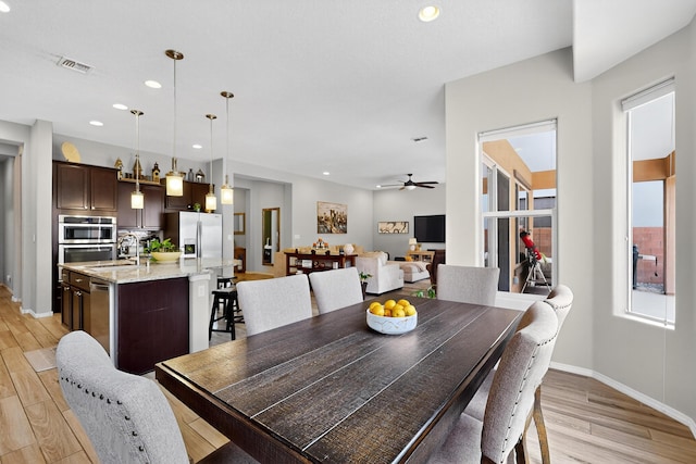4028 Colina Roja Ln NE, Rio Rancho, NM 87124 - dining space featuring light wood-type flooring, ceiling fan, and recessed lighting