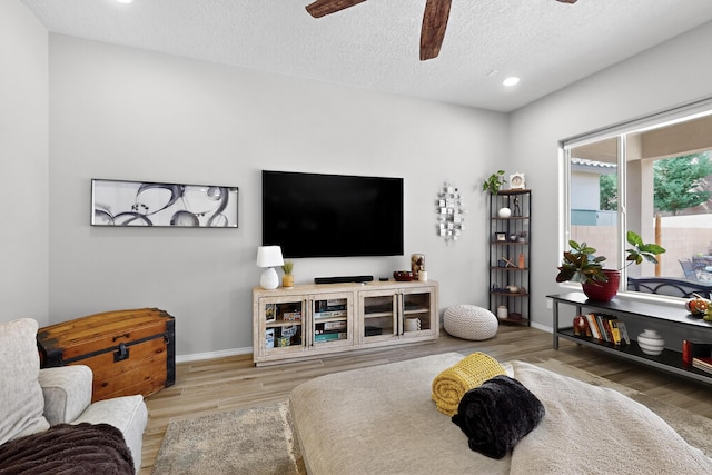 4028 Colina Roja Ln NE, Rio Rancho, NM 87124 - living area with ceiling fan, wood finished floors, recessed lighting, and a textured ceiling