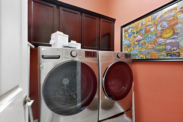 4028 Colina Roja Ln NE, Rio Rancho, NM 87124 - laundry room with washer and dryer, cabinet space, and a textured wall
