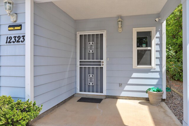 12323 Haines Ave NE, Albuquerque, NM 87112 - doorway to property featuring a patio area