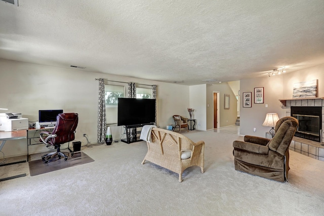 12323 Haines Ave NE, Albuquerque, NM 87112 - living room featuring carpet, a desk, a fireplace, a textured ceiling, and stairs