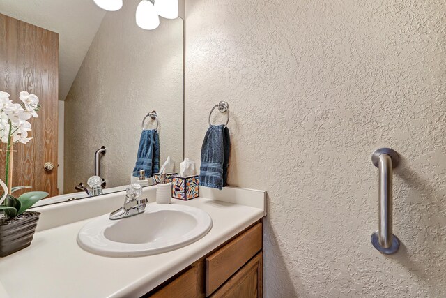 12323 Haines Ave NE, Albuquerque, NM 87112 - bathroom with vanity and a textured wall
