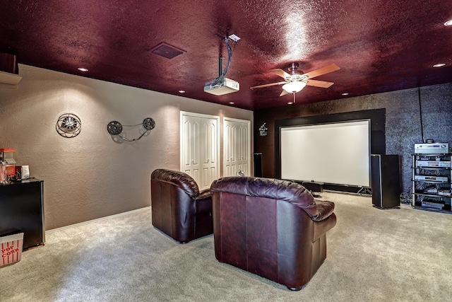 12323 Haines Ave NE, Albuquerque, NM 87112 - home theater with carpet floors, a textured wall, ceiling fan, baseboards, and recessed lighting
