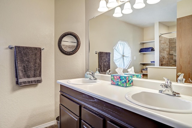 12323 Haines Ave NE, Albuquerque, NM 87112 - bathroom featuring double vanity, a textured wall, and a shower