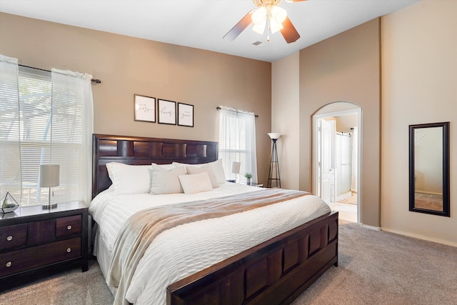 8031 Corn Mountain Pl NW, Albuquerque, NM 87114 - bedroom featuring light carpet, ensuite bath, baseboards, and a ceiling fan