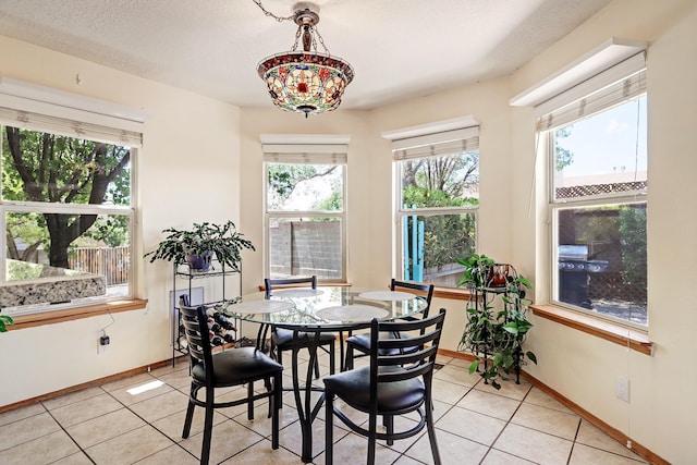 10301 Lawton St NW, Albuquerque, NM 87114 - dining space with light tile patterned flooring and baseboards