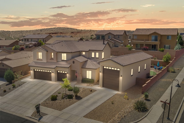 4118 Pico Norte Ln NE, Rio Rancho, NM 87124 - view of front facade featuring a residential view, stucco siding, concrete driveway, and a tiled roof