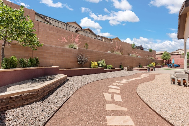 4118 Pico Norte Ln NE, Rio Rancho, NM 87124 - fenced backyard with a patio and a garden