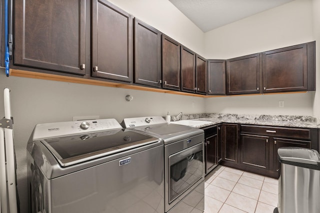 4118 Pico Norte Ln NE, Rio Rancho, NM 87124 - washroom with cabinet space, separate washer and dryer, and light tile patterned floors