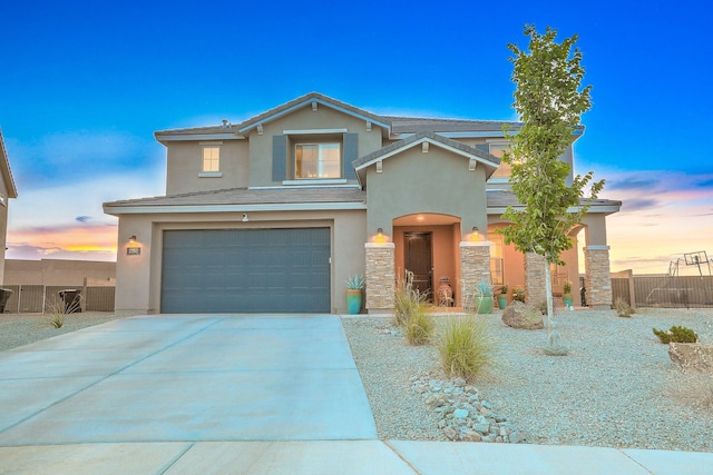 2350 Sandra Loop NE, Rio Rancho, NM 87144 - traditional-style house with stucco siding, a garage, concrete driveway, and stone siding
