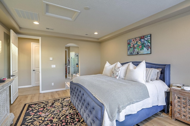 2350 Sandra Loop NE, Rio Rancho, NM 87144 - bedroom with light wood-type flooring, arched walkways, attic access, and recessed lighting